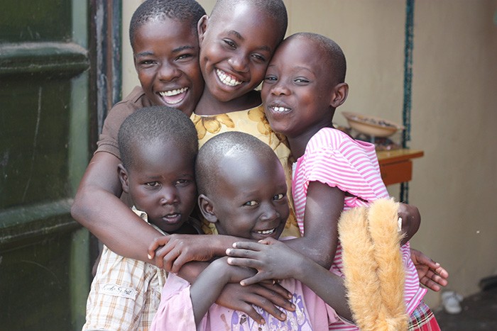 Children Smiling And Hugging