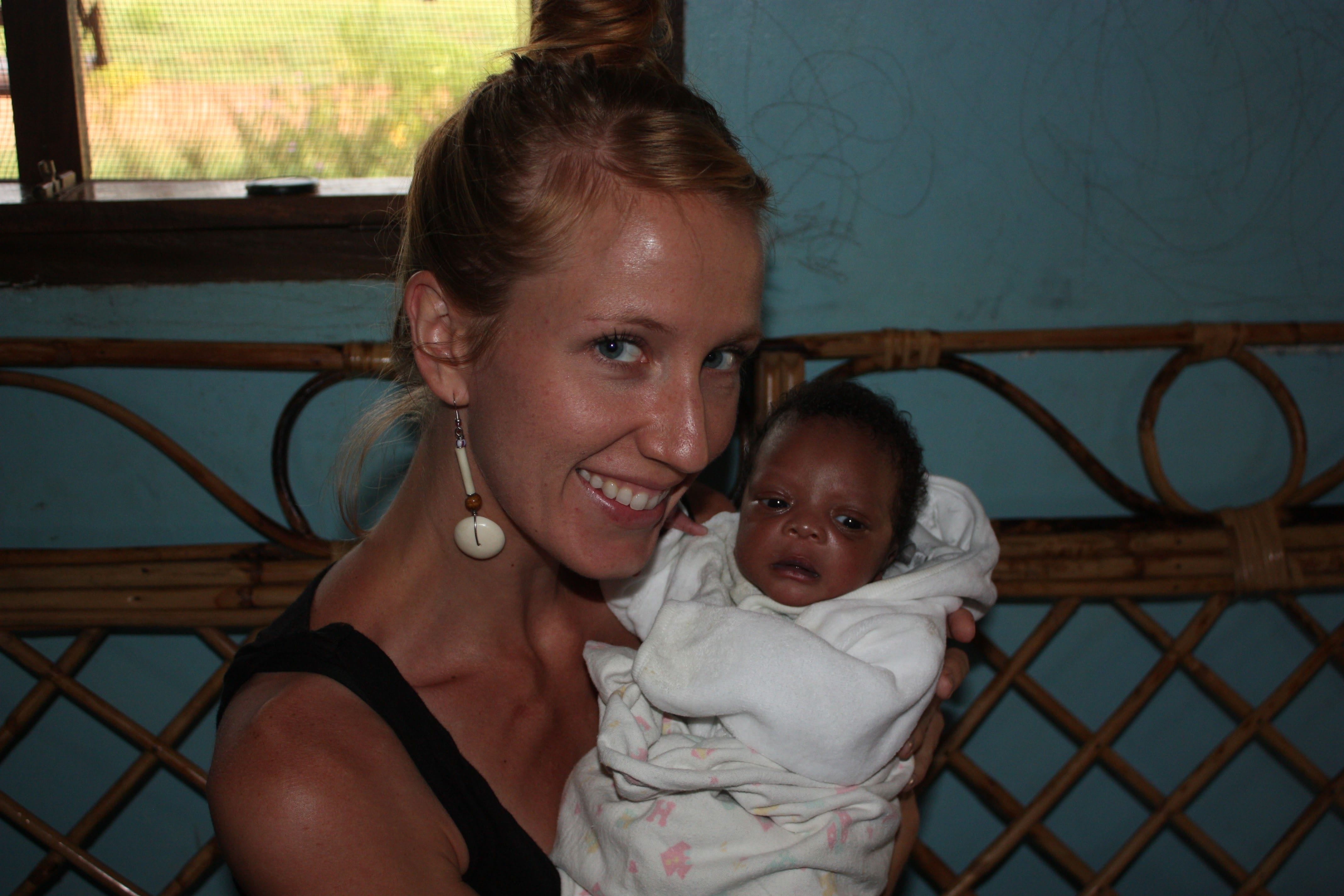 Andrea Holding A Baby